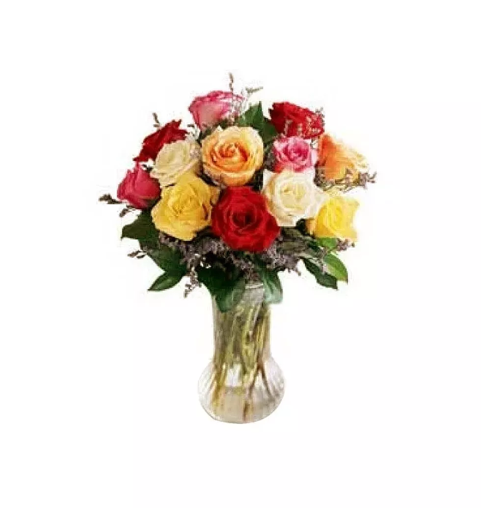 1 Dozen Mixed Color Roses in a glass vase with greens and filler